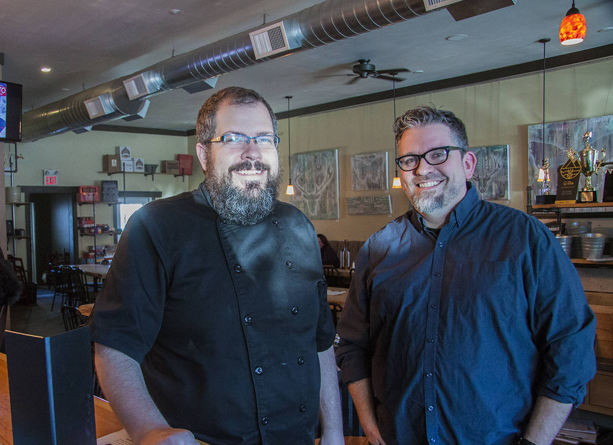 THRIVING BUSINESS - Cilantro and Chive Owner Riley Kay and Restaurant Manager Jason Burns were pleased to accept the 2018 Alberta Beer Award for Best Pub/Restaurant. Todd Colin Vaughan/Red Deer Express