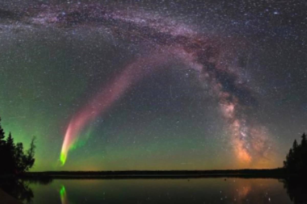 The celestial phenomenom known as “Steve” and the Milky Way are shown in the sky over Childs Lake, Manitoba. (Krista Trinder handout via The Canadian Press)