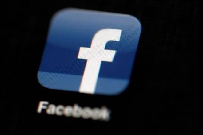 FILE - In this May 16, 2012, file photo, the Facebook logo is displayed on an iPad in Philadelphia. Facebook suspended Cambridge Analytica, a data-analysis firm that worked for President Donald Trump’s 2016 campaign, over allegations that it held onto improperly obtained user data after telling Facebook it had deleted the information. (AP Photo/Matt Rourke, File)