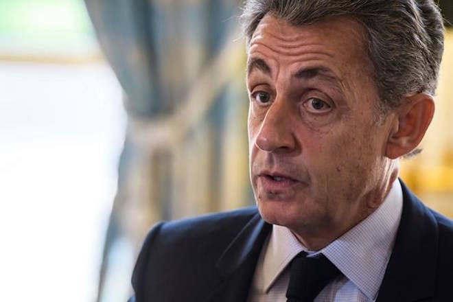 FILE - In this Nov. 6, 2017 file photo, former French President Nicolas Sarkozy attends newly named member of the Constitutional Council Dominique Lottin’s oath-taking ceremony at the Elysee Palace in Paris. Former French President Nicolas Sarkozy was placed in custody on Tuesday March 20 2018 as part of an investigation that he received millions of euros in illegal financing from the regime of the late Libyan leader Moammar Gadhafi.(Christophe Petit Tesson, Pool via AP, File)