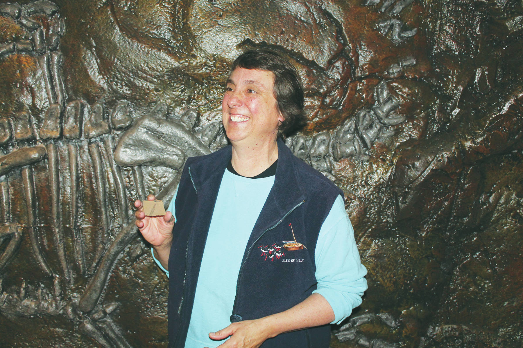 Andrea DeMeer                                Kathy Simpkins admires a copy of the rare fossil she discovered at the Allenby Mine site in April 2016.