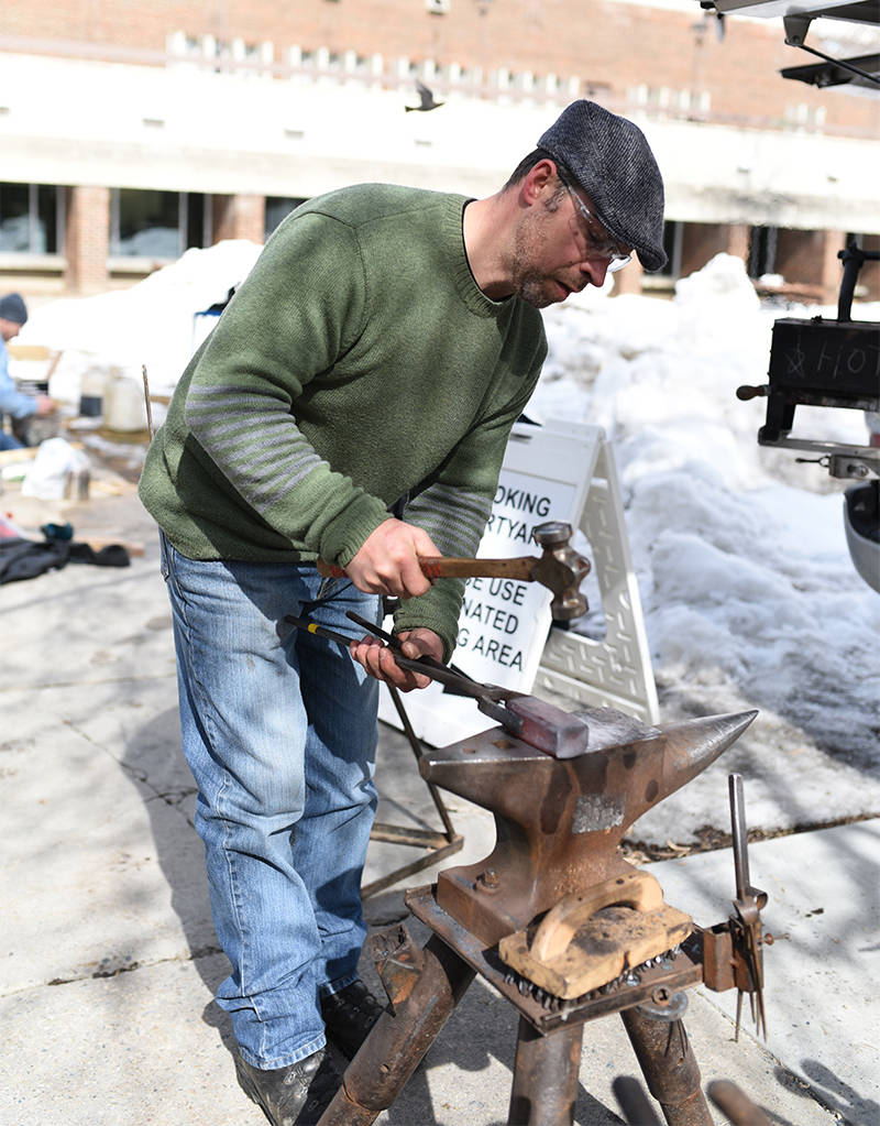 BLACKSMITH DEMONSTRATION - Red Deer Blacksmith Rocky Turel demonstrates his craft in the courtyard of Red Deer College for the Eco-Living Fair on Saturday.                                Michelle Falk/Red Deer Express