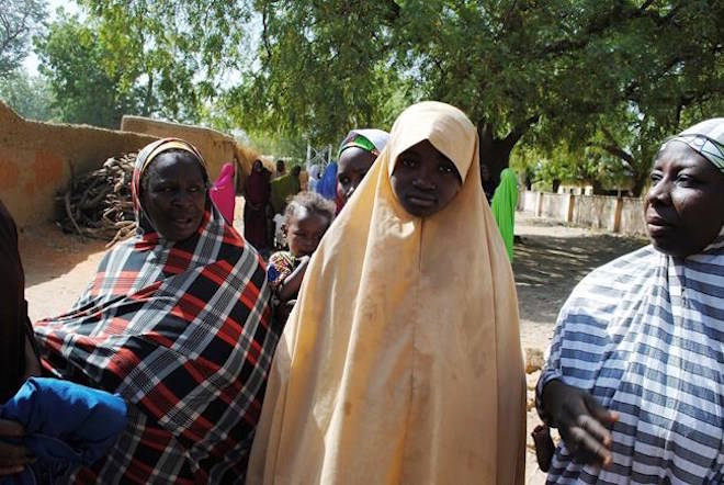 Falmata Abubakar, one of the girls freed from the Government Girls Science and Technical College Dapchi, is photographed after her release by Islamist Terrorist in Dapchi, Nigeria, Wednesday March. 21, 2018. Witnesses say Boko Haram militants have returned an unknown number of the 110 girls who were abducted from their Nigeria school a month ago. (AP Photo/Jossy Ola)