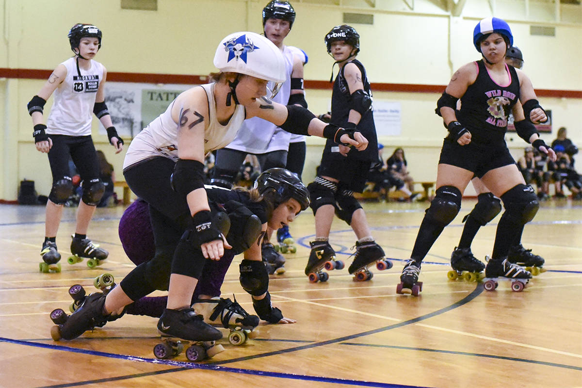 JUNIOR COMPETITION - Level Three Roller Derby skaters get physical as they race around the track. Full contact adult rules are permetted at this level. About 80 roller-skaters in the under 18 division came from across the province this weekend to compete in the Red Deer Nuclear Free Roller Derby League’s third annual Jr. Invitational.