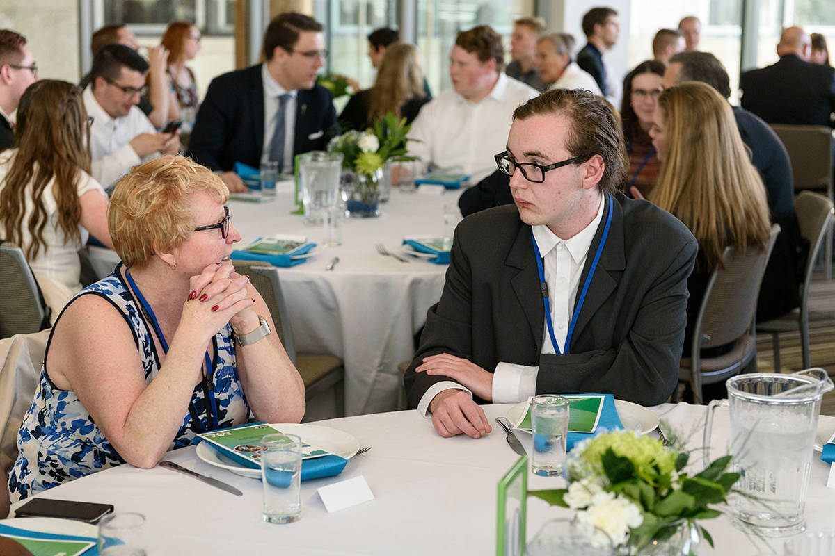 LEADERS OF TOMORROW - MLA South Barb Miller speaks with Lindsay Thurber student Alex Smith at a formal dinner during MLA for a Day last year.                                Photo submitted.