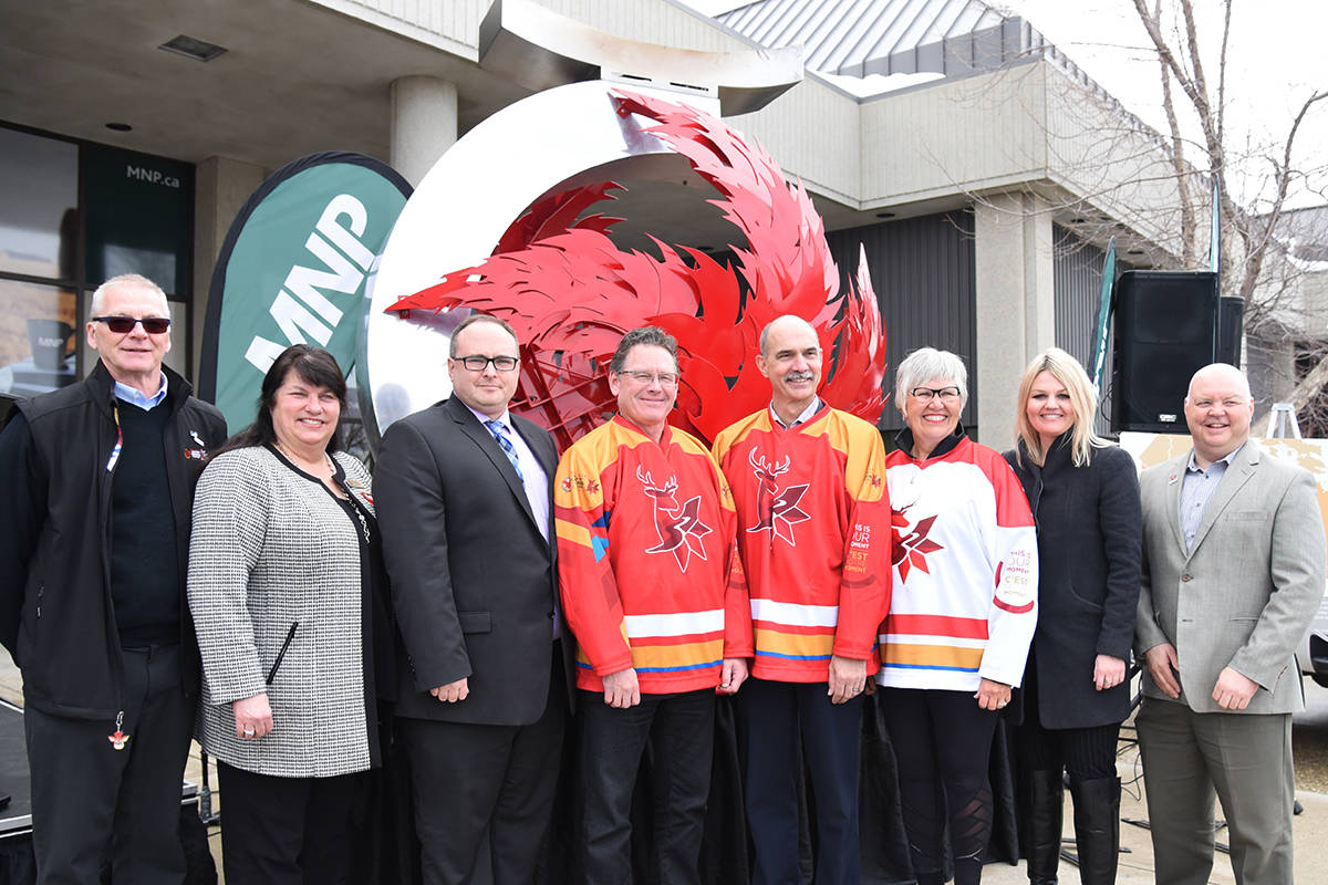 NATIONAL TORCH RELAY - Many came out to a press conference announcing that the Winter Games Torch Relay will be national this year. From left Serge Gingras, co-chair of Official Languages Committee; MLA Kim Schreiner; David Patterson, Game council president/CEO; Randy Mowat, MNP, Doug Stroh, MNP; Lyn Radford, Games board chair; Mayor Tara Veer and Scott Robinson, Games CEO, celebrated the news. Michelle Falk/Red Deer Express