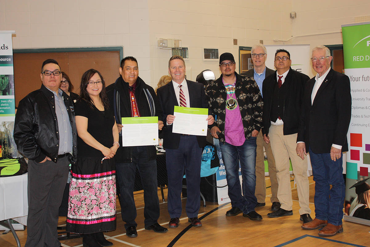 UNDERSTANDING - Chief Jonathan Frencheater from Sunchild First Nation and RDC’s President CEO Joel Ward, along with representatives from Sunchild First Nation and Red Deer College. photo submitted