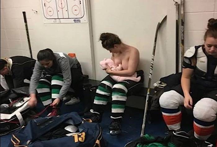 Hockey player Serah Small breastfeeds her child in the locker room during a game (Facebook)