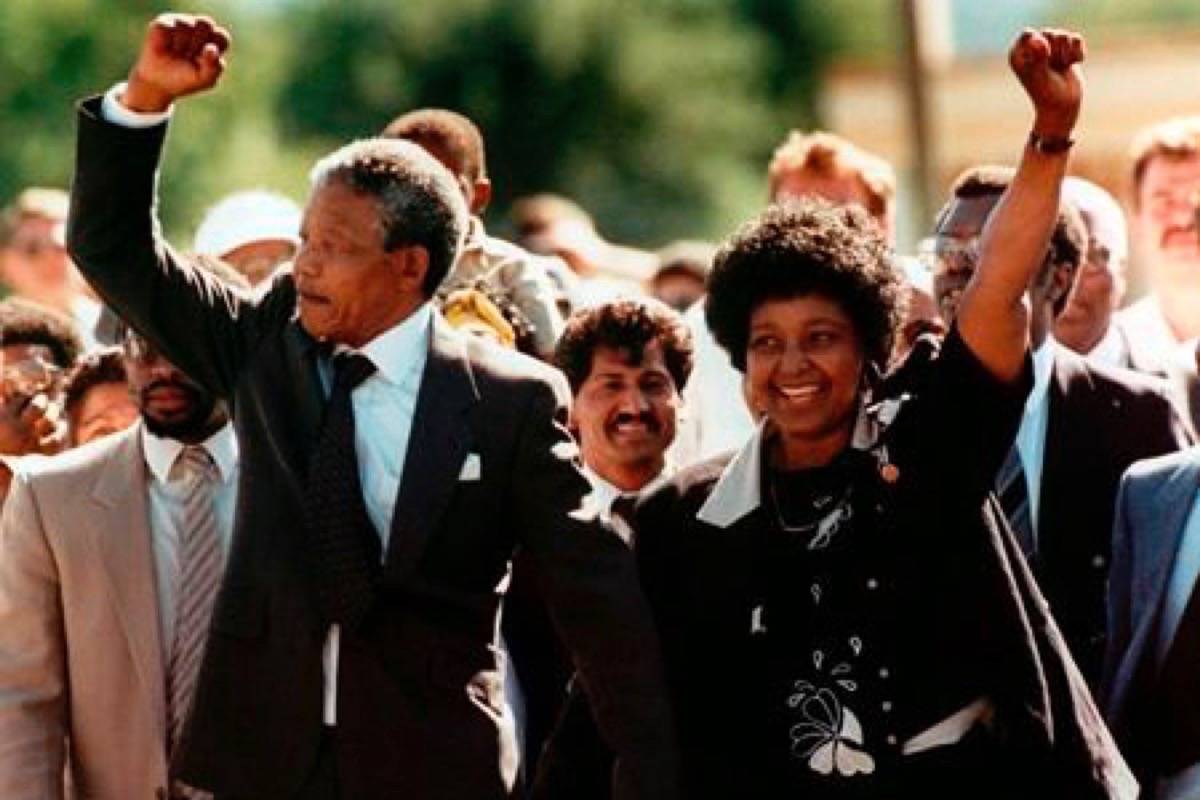 In this file photo dated Sunday, February 11, 1990, Nelson Mandela and wife Winnie, walk hand in hand, raising their clenched fists upon his release from Victor prison, Cape Town, 27 years in detention. (AP Photo)