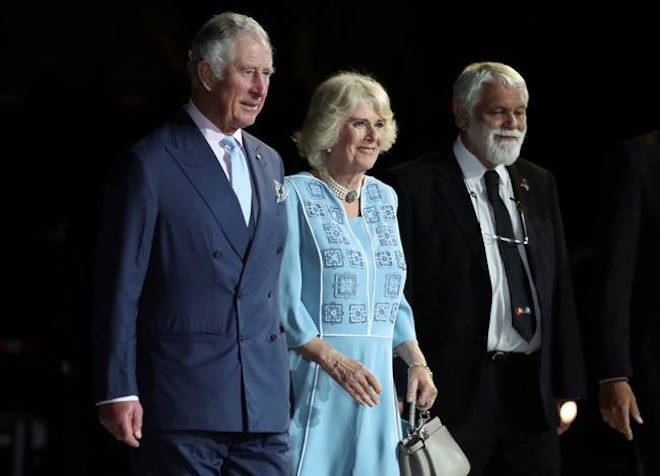 Prince Charles, left and Camilla, Duchess of Cornwall, center, arrive with Aboriginal Elder Ted Williams during the opening ceremony for the 2018 Commonwealth Games at Carrara Stadium on the Gold Coast, Australia, Wednesday, April 4, 2018. (AP Photo/Dita Alangkara)