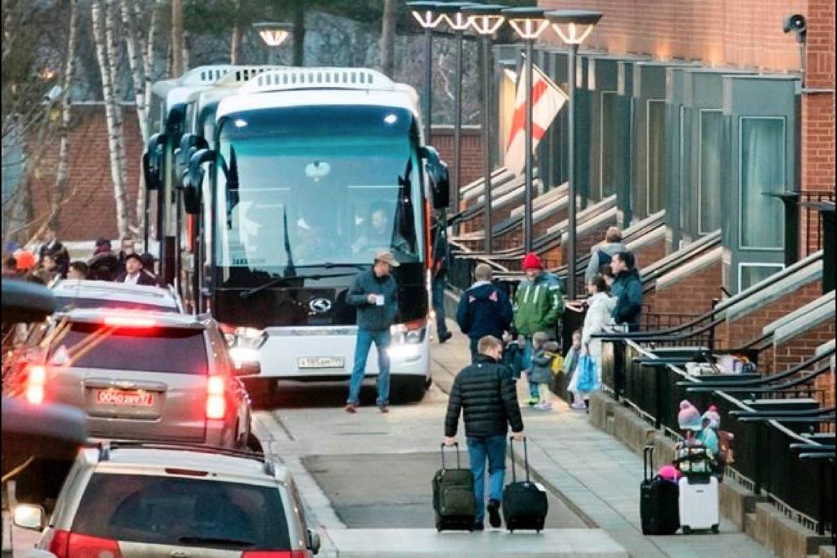 Buses wait to carry expelled diplomats to leave the U.S. Embassy in Moscow, Russia, Thursday, April 5, 2018. Russia last week ordered 60 American diplomats to leave the country by Thursday, in retaliation for the United States expelling the same number of Russians. (AP Photo/Pavel Golovkin)