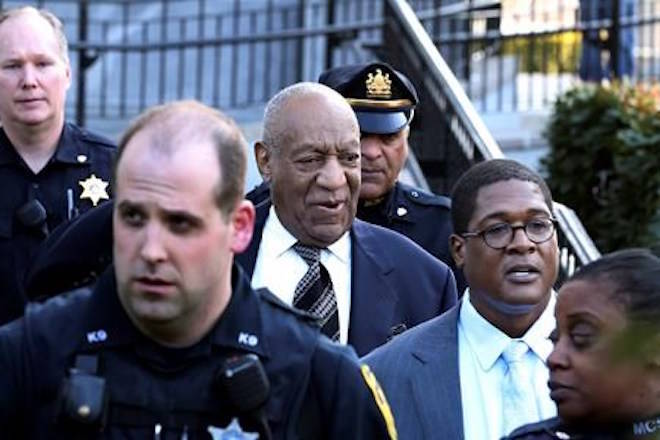 Bill Cosby, center, leaves hearings for jury selection in his sexual assault retrial with spokesperson Andrew Wyatt, second right, Thursday, April 5, 2018, at the Montgomery County Courthouse in Norristown, Pa. (AP Photo/Mel Evans)
