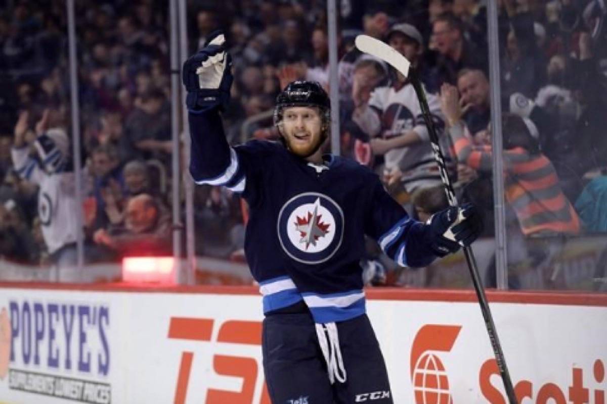 Winnipeg Jets Kyle Connor celebrates after scoring on the Nashville Predators during the second period in Winnipeg on March 25, 2018. (Trevor Hagan/The Canadian Press)