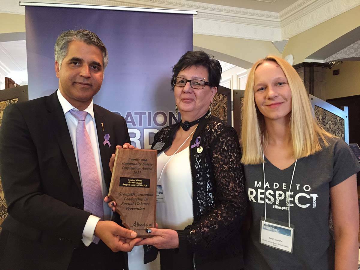 RECOGNITION - Community and Social Services Minister Sabir (left) presents the Central Alberta Sexual Assault Support Centre (CASASC) representatives Alma Garbe (middle) and Sarah Maetche (right) with an Inspiration Award. CASASC was the recipient of the group award for sexual violence prevention. photo submitted