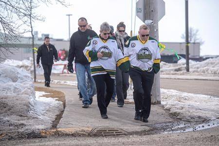 ‘Forever in our hearts’ Broncos head coach remembered for actions on and off the ice