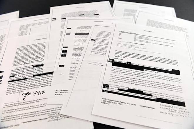 Copies of the memos written by former FBI Director James Comey are photographed in Washington, Thursday, April 19, 2018. President Donald Trump told former FBI Director James Comey that he had serious concerns about the judgment of his first national security adviser, Michael Flynn, according to memos maintained by Comey and obtained by The Associated Press. The 15 pages of documents contain new details about a series of interactions that Comey had with Trump in the weeks before his May 2017 firing. Those encounters include a White House dinner at which Comey says Trump asked him for his loyalty. (AP Photo/Susan Walsh)