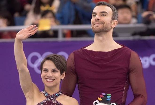 Pairs figure skating bronze medallists Canada’s Meagan Duhamel and Eric Radford wave from the podium during victory ceremonies at the Pyeonchang Winter Olympics Thursday, February 15, 2018 in Gangneung, South Korea. (Paul Chiasson/The Canadian Press)