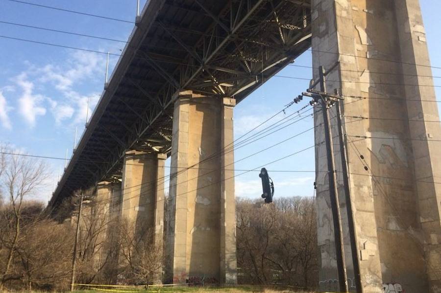 A car hangs from the Millwood bridge on Wednesday, May 2, 2018. (Image: Twitter/@KawarthaNOW)