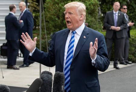 President Donald Trump tells reporters a time and place for his meeting with North Korea’s Kim Jong Un has been set and will be announced soon, as he leaves for Dallas to address the National Rifle Association, in Washington, Friday, May 4, 2018. (J. Scott Applewhite/AP)
