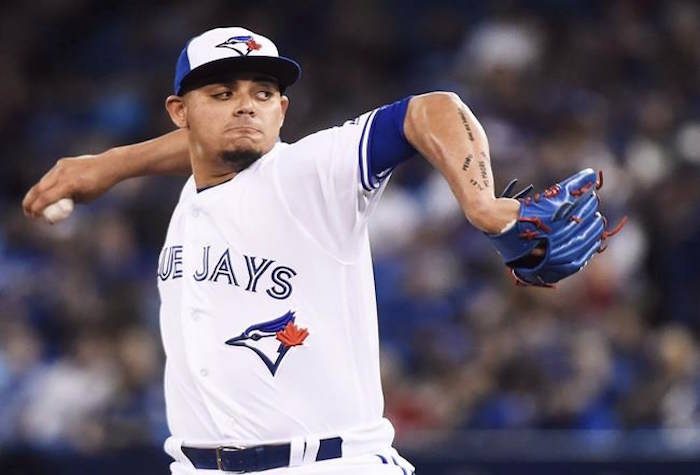 Toronto Blue Jays relief pitcher Roberto Osuna (54) pitches against the Milwaukee Brewers during ninth inning interleague baseball action in Toronto on Tuesday, April 11, 2017. THE CANADIAN PRESS/Nathan Denette