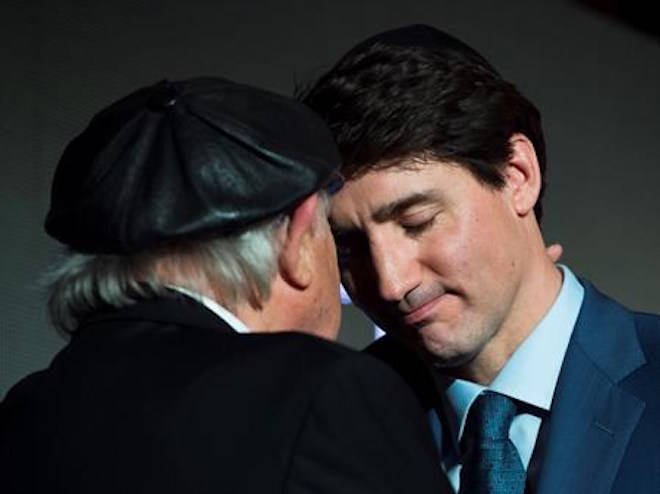 Prime Minister Justin Trudeau, right, share a moment with Holocaust survivor Nate Leipciger, left, after delivering remarks at the March of Living 30th anniversary gala in Toronto on Tuesday, May 8, 2018. THE CANADIAN PRESS/Nathan Denette