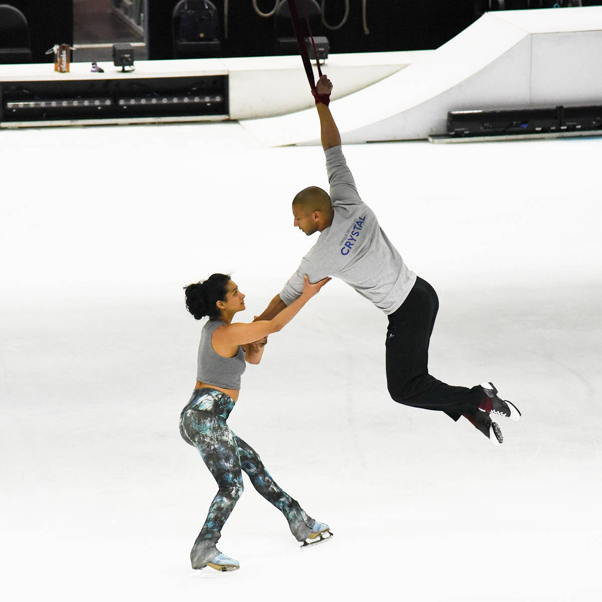 OPENING NIGHT REHEARSAL - Nobahar Dadui, who plays Crystal, and Jerome Sordillon, aerial strap specialist, enact a romantic scene from the “breakthrough ice experience” in a practise before opening night.                                Michelle Falk/Red Deer Express