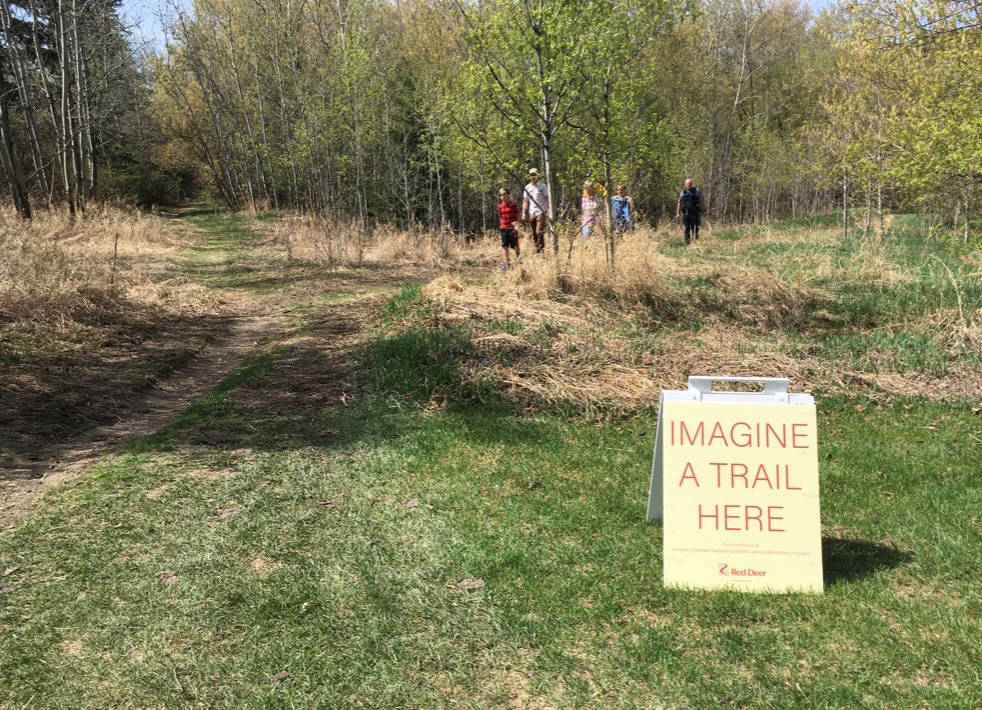 NEW ROUTE - Local residents take a closer look at a new trail route being planned for Riverside Meadows during an open house about the project held May 12th.                                Mark Weber/Red Deer Express