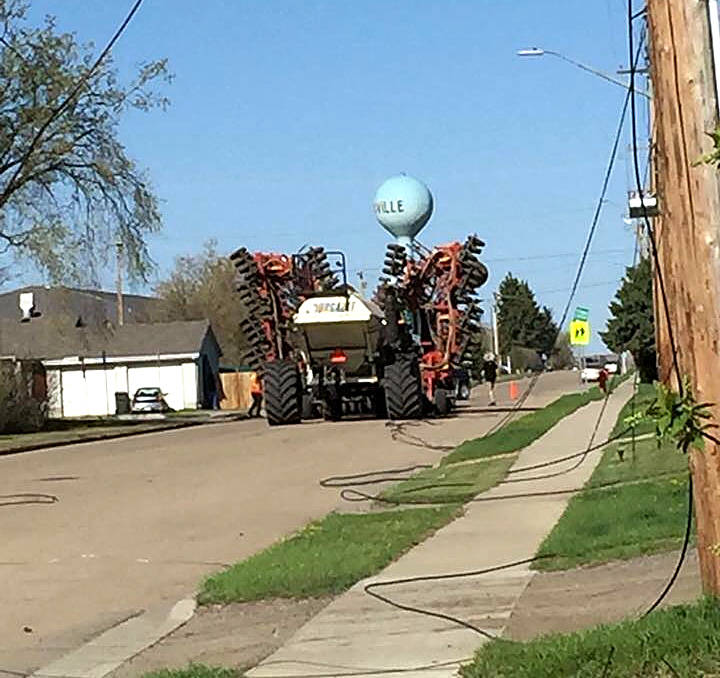 On the morning of May 13 a farmer drove his air seeder through Eckville, taking down power lines in its wake. The damage took out the power to 741 residents in Eckville. Photo submitted