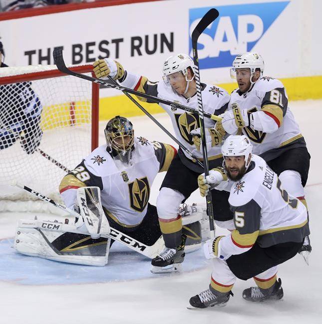 Vegas Golden Knights’ Cody Eakin (21), Jonathan Marchessault (81) and Deryk Engelland (5) defend in front of goaltender Marc-Andre Fleury (29) during Game 2 in the Western Conference Finals against the Winnipeg Jets on Monday. (Trevor Hagan/The Canadian Press)
