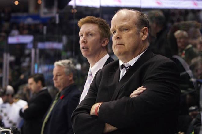 London Knights general manager Mark Hunter, right, and assistant coach Jeff Paul, looks on during a break in second period action against the Edmonton Oil Kings at the Memorial Cup CHL hockey tournament in London, Ont., Sunday, May 18, 2014. THE CANADIAN PRESS/Dave Chidley