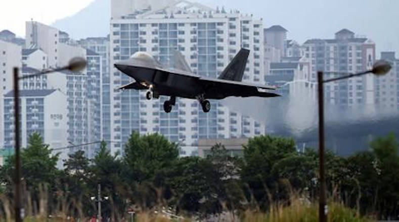 FILE - In this May 16, 2018, file photo, a U.S. F-22 Raptor stealth fighter jet lands as South Korea and the United States conduct the Max Thunder joint military exercise at an air base in Gwangju, South Korea. (Park Chul-hog/Yonhap via AP)