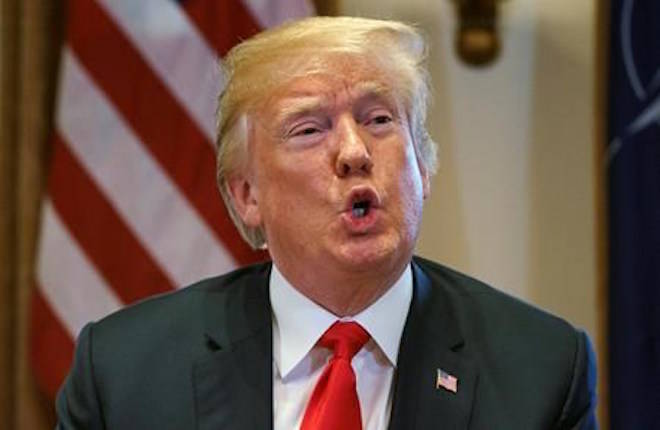 FILE - In this Thursday, May 17, 2018, file photo, U.S. President Donald Trump speaks during a meeting in the Cabinet Room of the White House, in Washington. Trump said he will “demand” that the Justice Department open an investigation into whether the FBI infiltrated his presidential campaign, an extraordinary order that came hours before his legal team said the special counsel indicated its investigation into the president could be concluded by September. (AP Photo/Carolyn Kaster, File)