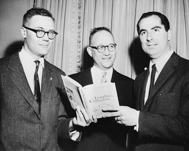FILE - In this March 24, 1960 file photo, the three winners of the National Book Award, Robert Lowell, from left, awarded for the most distinguished book of poetry, Richard Ellmann, won in the nonfiction category, and Philip Roth, received the award in the fiction category for his book “Goodbye, Columbus,” pose at the Astor Hotel in New York City, (AP Photo, File)
