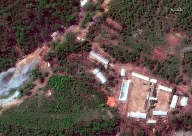 FILE - This Wednesday, May 23, 2018 satellite file image provided by DigitalGlobe, shows the Punggye-ri test site in North Korea. The demolition happened Thursday at the site deep in the mountains of the North’s sparsely populated northeast. The planned closing was previously announced by leader Kim Jong Un ahead of his planned summit with U.S. President Donald Trump next month. (DigitalGlobe via AP, File)