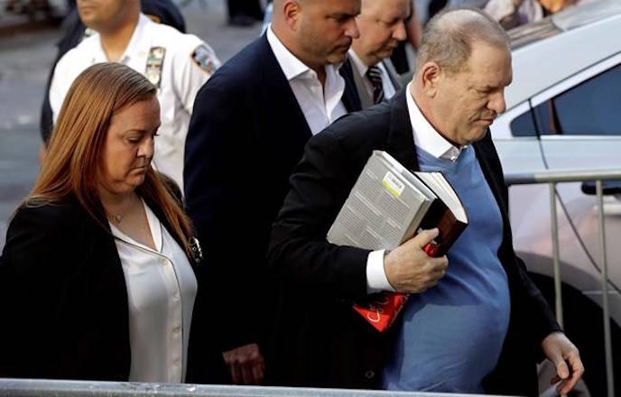 Harvey Weinstein arrives at the first precinct while turning himself to authorities following allegations of sexual misconduct, Friday, May 25, 2018, in New York. (AP Photo/Julio Cortez)