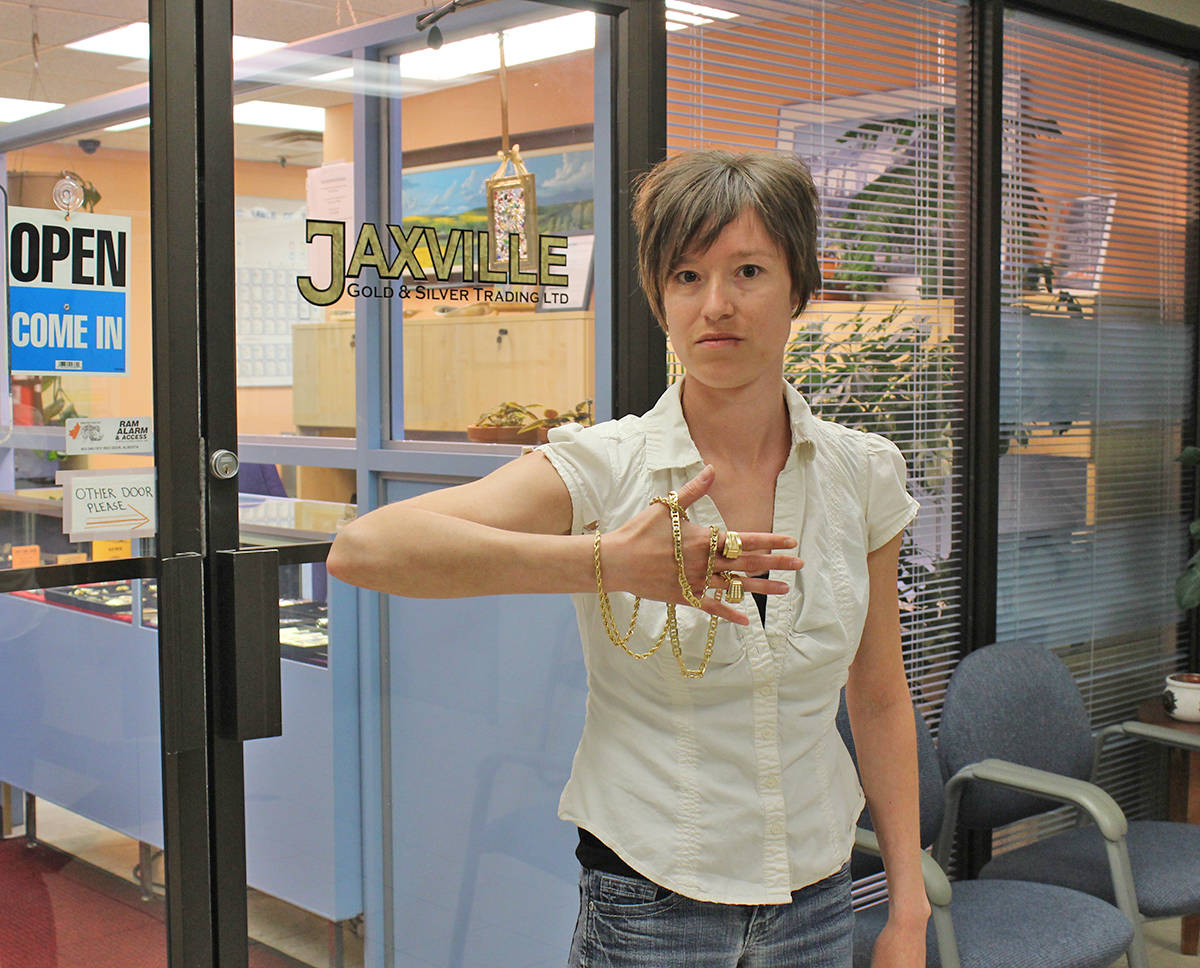 GETTING SCAMMED - Nairn Boutrup of Jaxville Gold & Silver Trading Ltd. holds up the counterfeit gold that customers have been bringing in after being scammed. Carlie Connolly/Red Deer Express