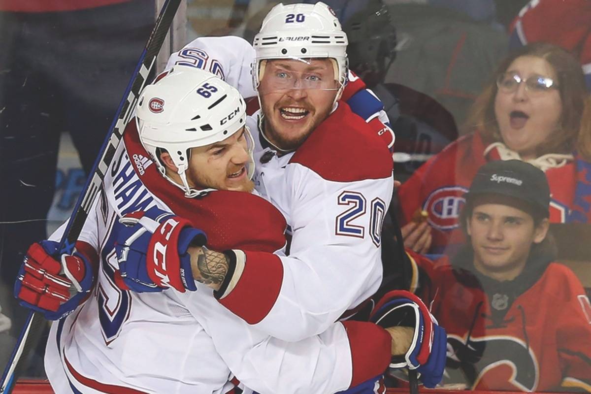 Montreal Canadiens’ Nicolas Deslauriers (20) celebrates his goal with teammate Andrew Shaw during second period NHL hockey action against the Calgary Flames, in Calgary on Friday, Dec. 22, 2017. (Todd Korol/The Canadian Press)