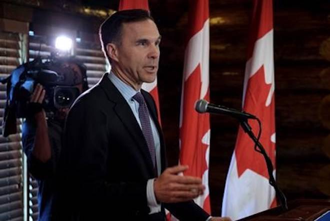 Minister of Finance Bill Morneau speaks to the media in Calgary, Alta., Wednesday, May 30, 2018.THE CANADIAN PRESS/Jeff McIntosh