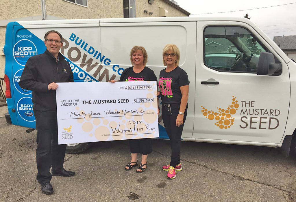 GOOD CAUSE - Scott Tilbury accepts a cheque on behalf of The Mustard Seed from Suzanne Guthrie and Val Jensen of the PCN Women’s Fun Run, which raised over $34,000. photo submitted