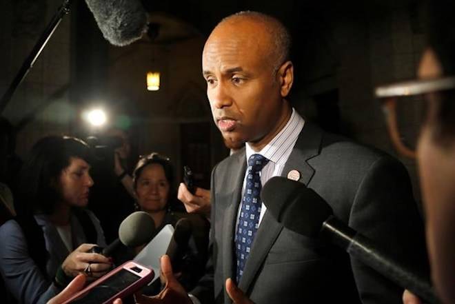 Minister of Immigration, Refugees and Citizenship Ahmed Hussen speaks to reporters outside the House of Commons on Parliament Hill on Thursday, May 31, 2018. THE CANADIAN PRESS/ Patrick Doyle
