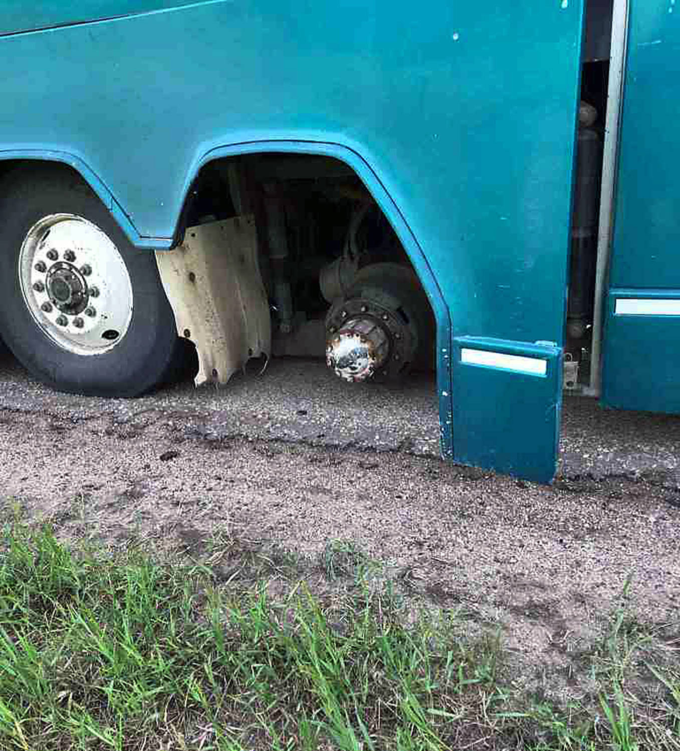 A shot of the one rear axle, minus both tires, of the original bus that was transporting a group of Special Olympics athletes and coaches from Calgary to a training camp weekend in Edmonton June 1. Image: Ponoka County East District Fire Department