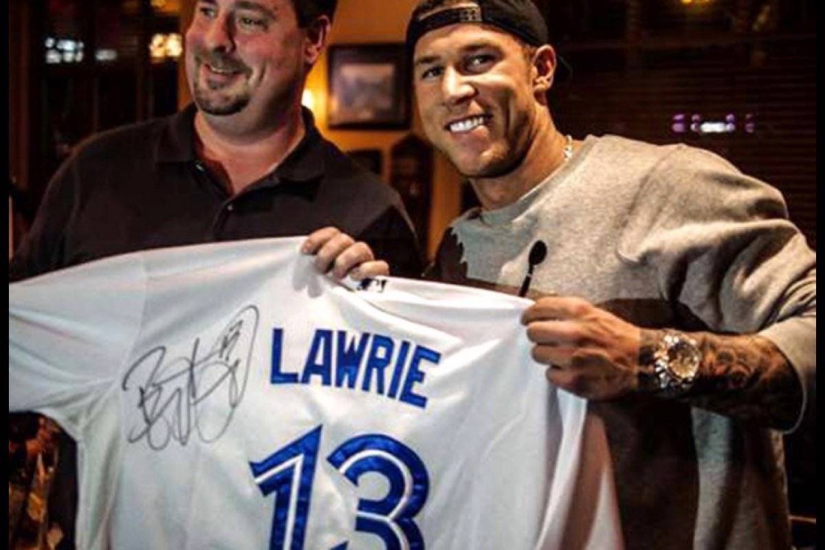 Toronto Blue Jays’ Brett Lawrie (right) donated an autographed jersey as an auction prize in support of Langley Child Development Centre and Langley Big Brothers Big Sisters in 2013. (Black Press file photo)