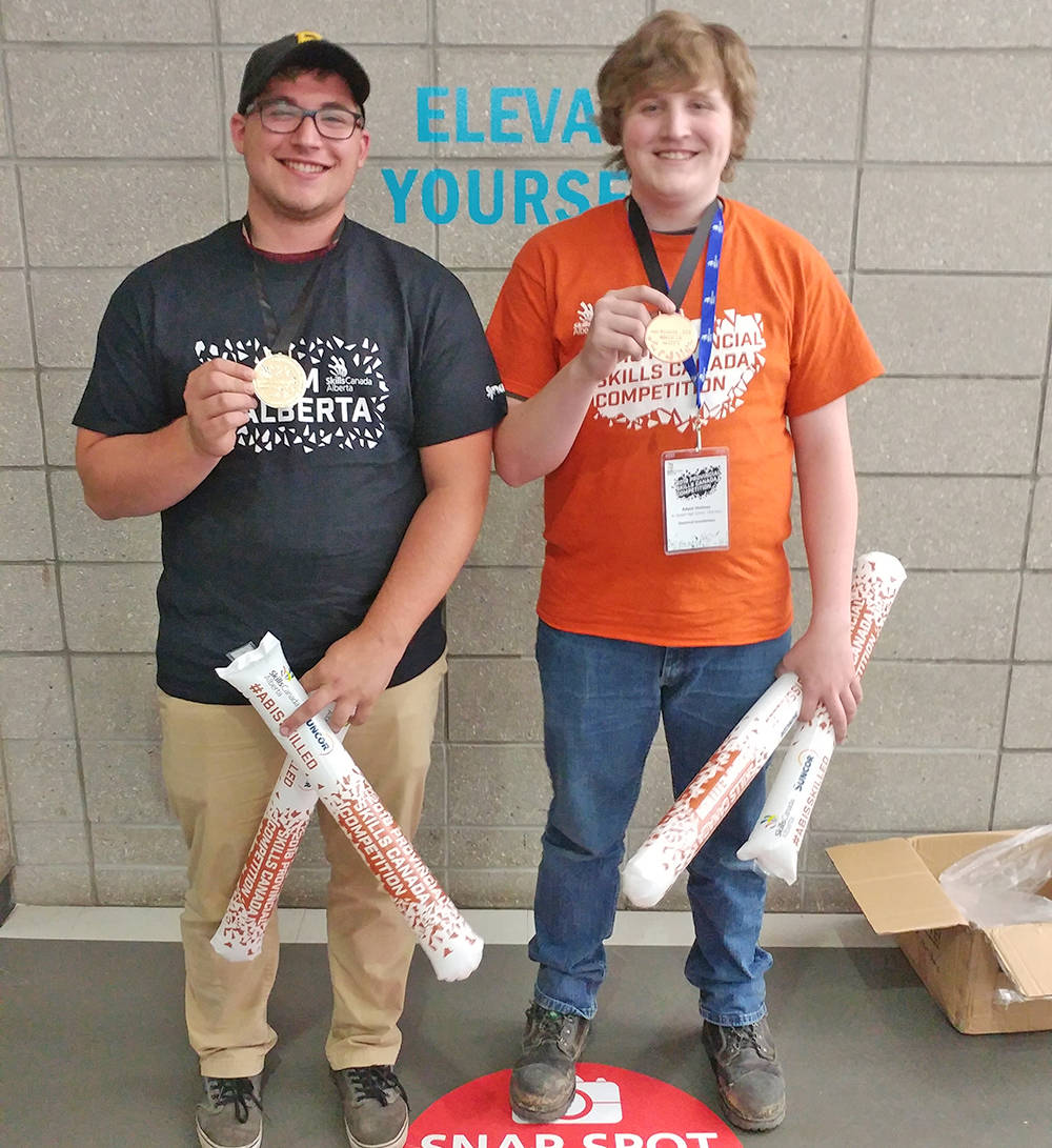RECIPIENTS - Tristen Hatto and Adam Holmes were Skills Alberta medal winners, with Hatto winning the Provincial Gold Medal in electrical installations. Missing from the photo is Shawn Roland. photo submitted