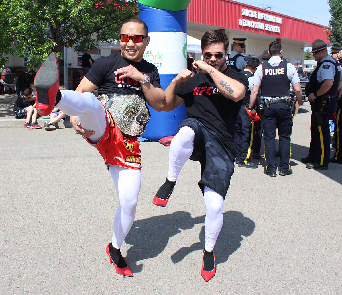 POWER IN NUMBERS - Steve Grandeza and Russell Decoteau of the UFC Gym took part in the Walk A Mile In Her Shoes event. Carlie Connolly/Red Deer Express