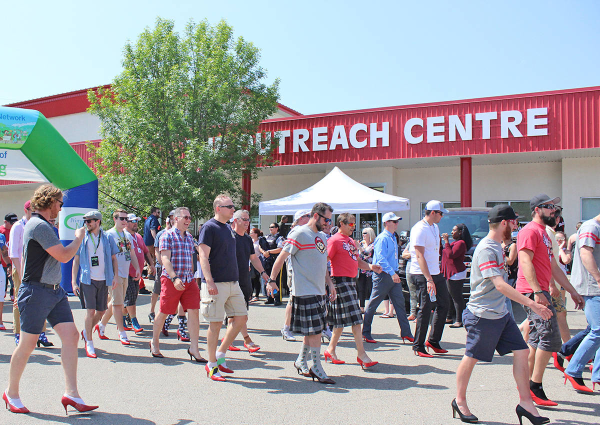 WALK A MILE - Many men gathered June 7th for the annual Walk A Mile In Her Shoes event, raising money for the Women’s Outreach Centre. Carlie Connolly/Red Deer Express