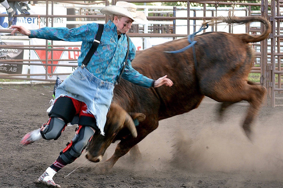 A bull chases Brody Tattrie during the freestyle bullfighting event in Stettler for the 10th Annual Stettler Steel Stampede June 7. (Lisa Joy/Stettler Independent)