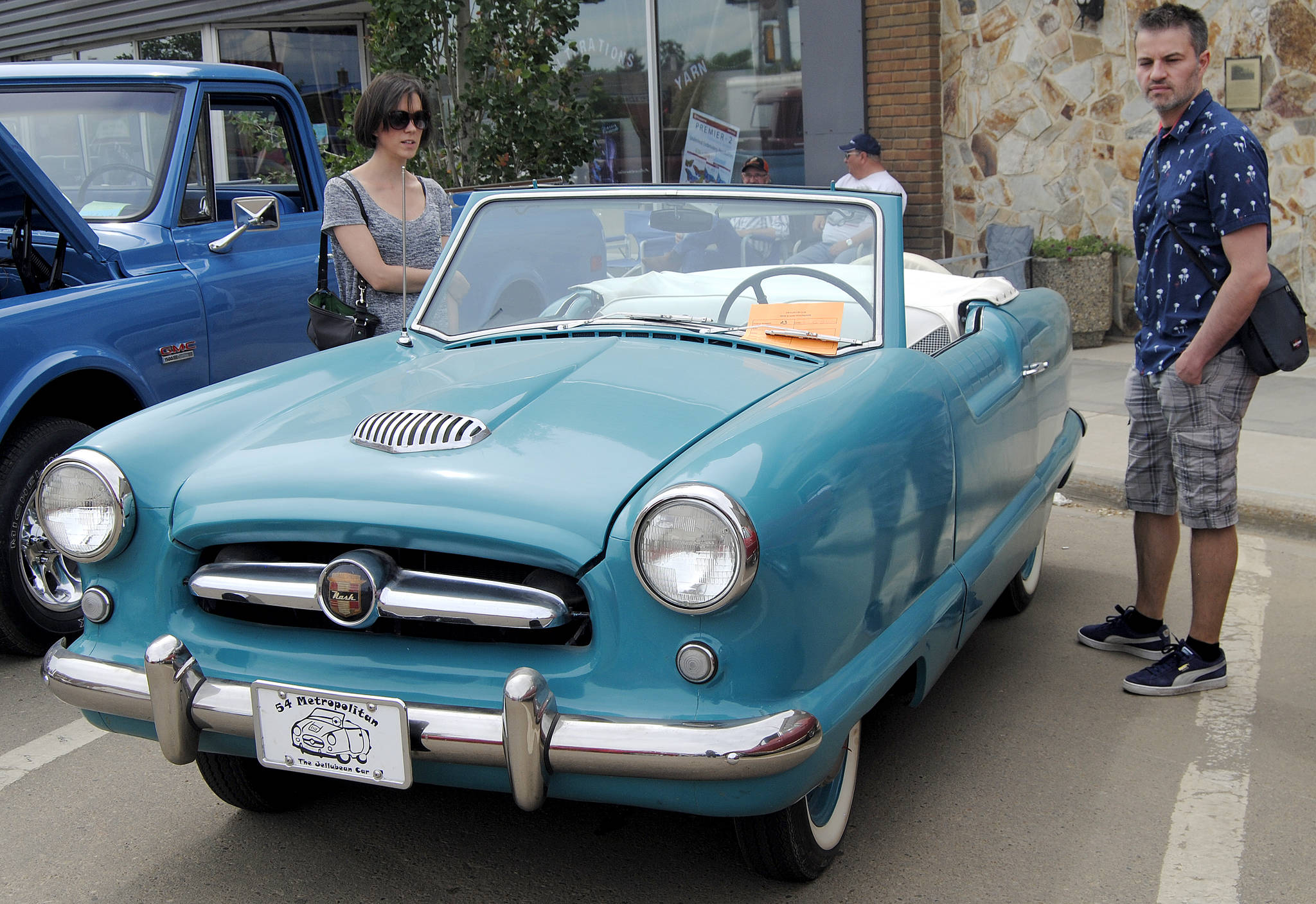 Vladimir Rancic and Jezebel Polegato check out this 1954 car during Stettler’s car show on main street June 9. The couple came from Italy and are residing in Edmonton. They happened to drive through Stettler Saturday and noticed the car show. (Lisa Joy/Stettler Independent)