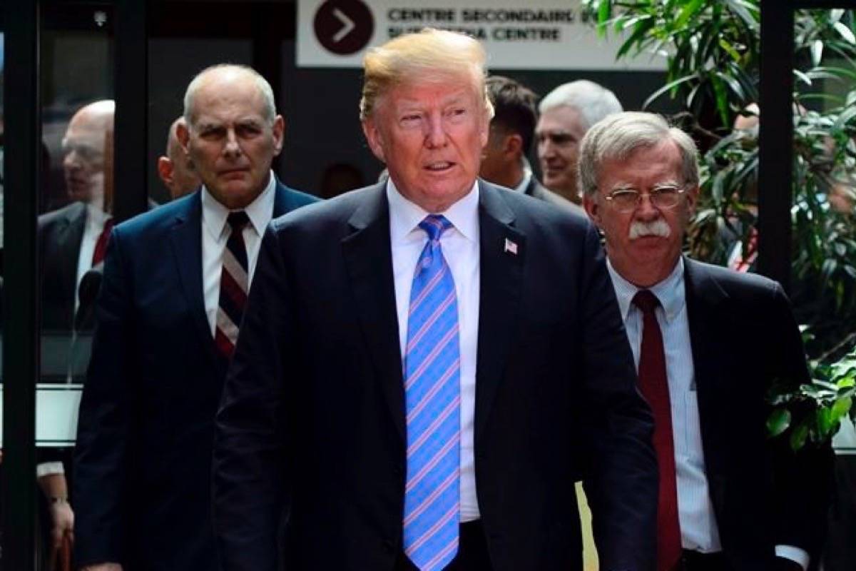 U.S. President Donald Trump leaves the G7 Leaders Summit in La Malbaie, Que., on Saturday, June 9, 2018., with White House Chief of Staff John Kelly, left, and National Security Adviser John Bolton. (Sean Kilpatrick/The Canadian Press)