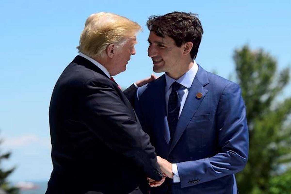 Prime Minister Justin Trudeau greets U.S. President Donald Trump during the official welcoming ceremony at the G7 Leaders Summit in La Malbaie, Que., on Friday, June 8, 2018. THE CANADIAN PRESS/Sean Kilpatrick