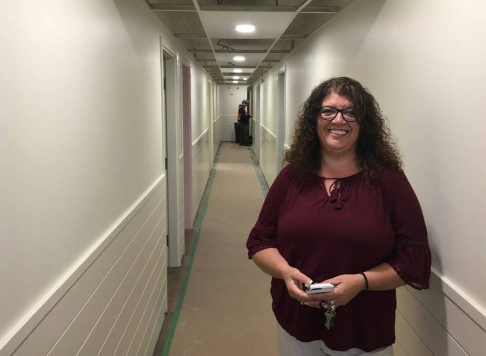 LOOKING AHEAD - Barb Barber, executive director of The Outreach Centre, stands in the hallway of what will ultimately be The Dragonfly Children’s Healing Centre. The facility will allow staff to greatly expand their services for children affected by domestic violence.                                Mark Weber/Red Deer Express